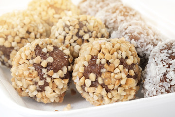 Chocolate donuts ball / View of chocolate donuts ball on white foam container.