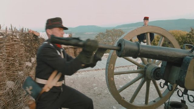 French soldier cleans gun barrel before shot