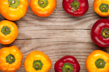 vegetables crop  on wooden background sweet pepper, top view, frame, copy space