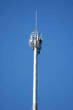 workers on a telecommunication tower
