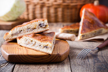 Slices of cabbage and mushroom pie with cheese