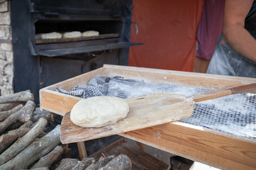Drawers with prepared bread dough to be placed in the oven.