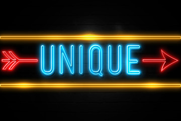 Unique  - fluorescent Neon Sign on brickwall Front view