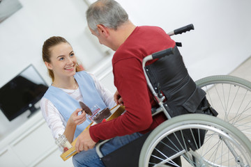 disabled patient talking with a beautiful young nurse