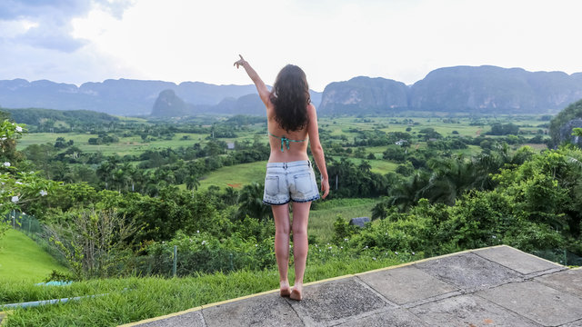Happy girl in the Vinales valley, an idyllic region in western Cuba