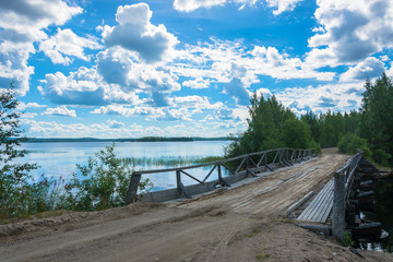 Landscape with a wooden bridge between the two lakes.