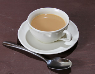 A cup of warm tea latte