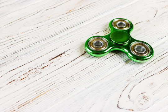 Close up shot of an green fidget spinner