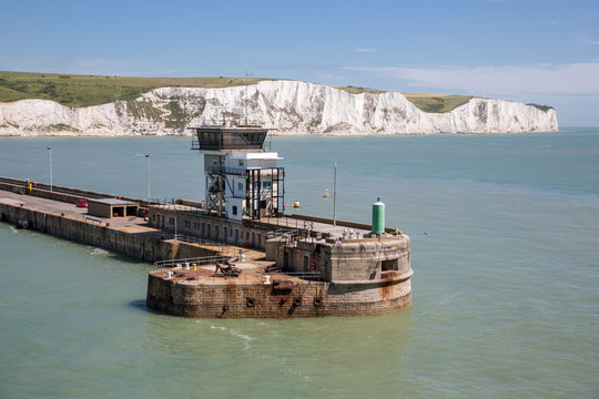 View at harbor Dover with pier and white cliffs