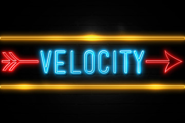 Velocity  - fluorescent Neon Sign on brickwall Front view