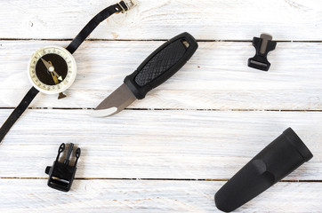 Knife, a compass and a flint for a tourist and a hunter.
