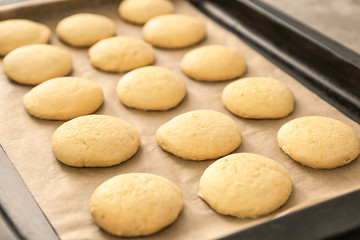 Fototapeta na wymiar Homemade cookies with lemon flavor on baking tray