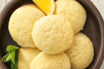 Fototapeta na wymiar Homemade cookies with lemon flavor on plate, closeup