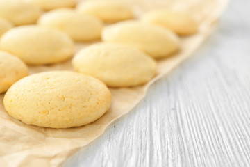 Homemade cookies with lemon flavor on parchment paper, closeup