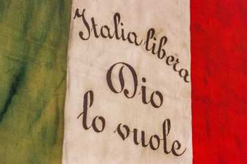 Old Italian flag saying "Free Italy, God wants it", Turin, Italy