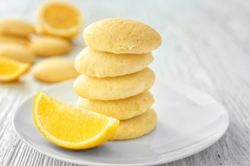 Fototapeta na wymiar Plate with homemade lemon cookies on wooden table