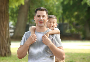 Happy father and son in park