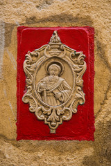 Relief representing a religious scene on the street
