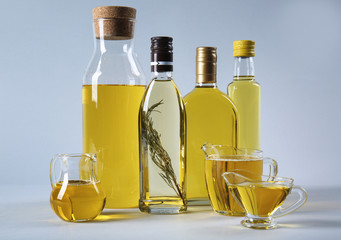 Composition with cooking oil on light background