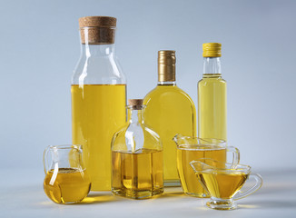 Composition with cooking oil on light background