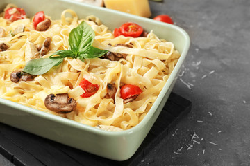 Delicious roasted turkey tetrazzini in baking dish on table