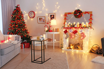 Room decorated for Christmas and beautiful fir tree