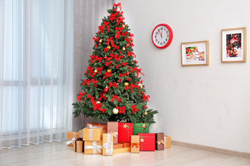 Beautiful Christmas tree in light room