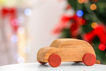 Decorative wooden car on blurred background