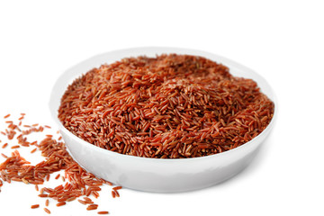 Bowl with jasmine brown rice on white background