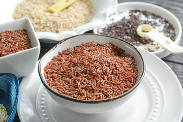 Bowl with jasmine brown rice on plate