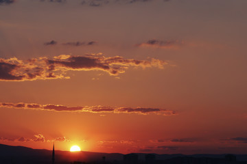 Naklejka premium Sunset over Ankara Turkey skies. beautiful landscape with a red sunset sky over the field 