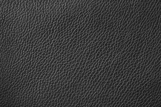 Black closeup leather pattern background.