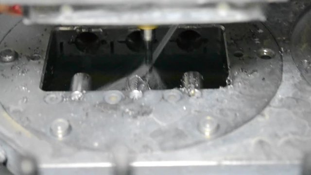 Milling machine. Milling machine that mills titanium Dental implants. Close-up plan