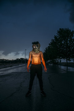Man with sack mask on road