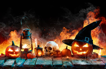 Halloween In Flame - Burning Pumpkins On Wooden
