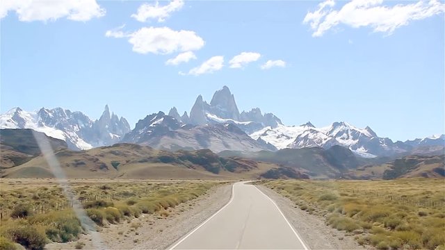 Mount Fitz Roy and Cerro Torre Seen Through a Bus Window on Road Towards the Small Mountain Village El Chalten, Los Glaciares National Park, Santa Cruz province, Argentina.  