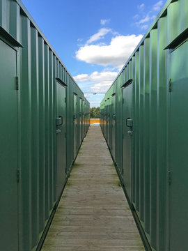 Shipping containers converted into storage units in a line.