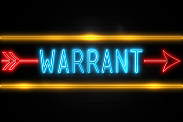 Warrant  - fluorescent Neon Sign on brickwall Front view