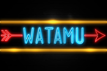 Obraz premium Watamu - fluorescent Neon Sign on brickwall Front view