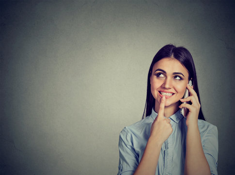 Girl calling with a mobile phone smiling