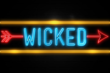 Fototapeta premium Wicked - fluorescent Neon Sign on brickwall Front view