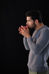 Thoughtful man having a mug of coffee