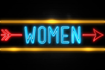 Naklejka na ściany i meble Women - fluorescent Neon Sign on brickwall Front view
