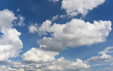 Fototapeta na wymiar A lot of cumulus clouds on the blue sky background