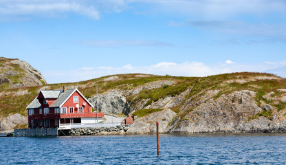 Red house close to the sea - coastal scenery, western Norway