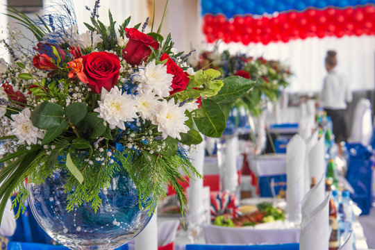 beautiful colorful flower bouquets in glass vases on tables