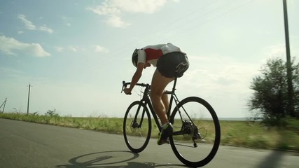 Young cyclist riding bike single track green route sunset rapid slow motion