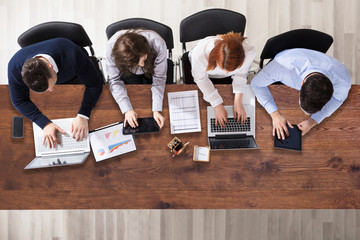 Group Of Businesspeople Working In Office