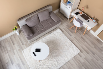 Living Room With Computer Desk And Sofa
