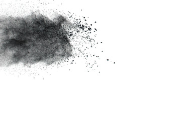 Black powder explosion against white background.